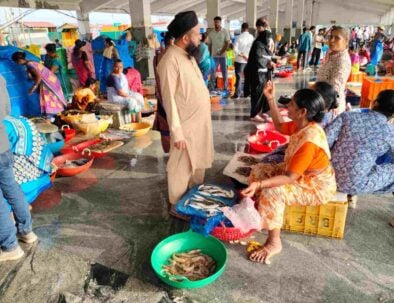 Malpe fish market covered harbour Karnataka morning catch prawns mackerel women vendors buyer