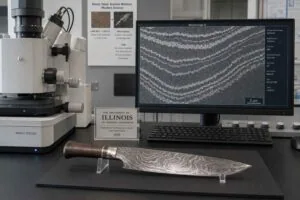 19th century scientific laboratory setting with crucibles retorts and failed Damascus steel blade attempt on workbench representing six centuries of European failure to replicate Wootz steel formula
